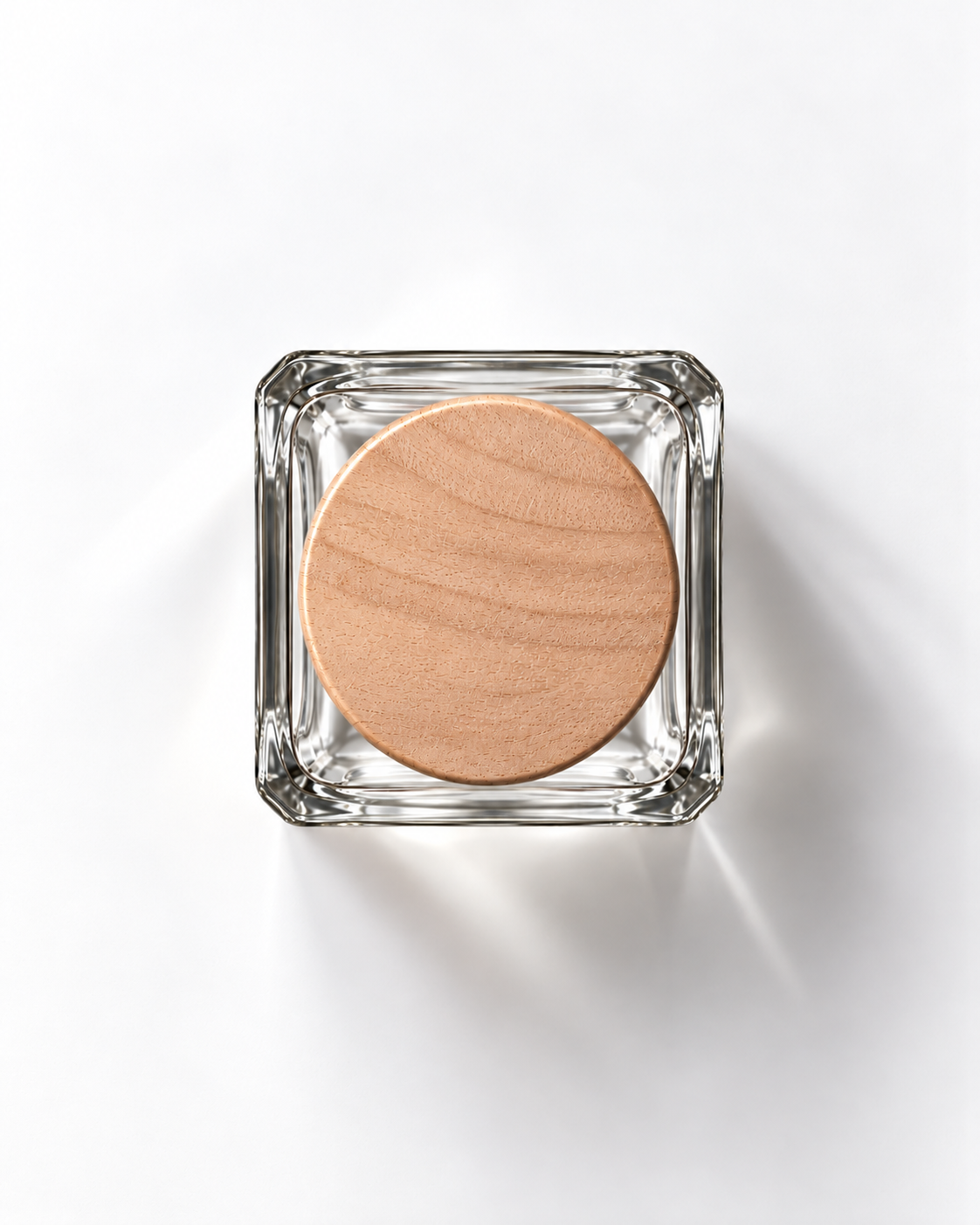Golden Harbour extrait de parfum from above: clear juice in a square glass bottle with a round wooden cap